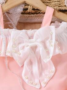 SHEIN Ensemble pour jeune fille de style français doux : débardeur avec nœud décoratif, jupe short asymétrique assortie, et mini sac bandoulière avec détails floraux 3D - Rose bonbon - Voir 7