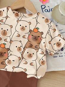 SHEIN Set de 2 piezas de camiseta de manga corta holgada y shorts con estampado de capibara lindo e informal para niñas, adecuado para verano