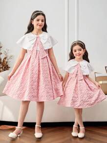 SHEIN Young Girl Color-Block Large Lapels Patchwork Floral Jacquard Bowknot Decor Midi Dress, Shawl Neck, Ruffle Cake Dress, Flower Girl, Cute & Elegant & Sweet & Vintage & Fashionable. Mom And Daughter & Sisters Matching, Family Vacation, Daily Wear, Home Family Gatherings And Special Occasions, Sibling Outfits, Gorgeous Princess, Party Wear, For Birthdays, Spring/Summer. - Pink - View 12