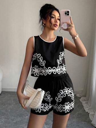 Rafferiza Set de 2 piezas con top sin mangas de estampado gráfico y contraste de color con shorts