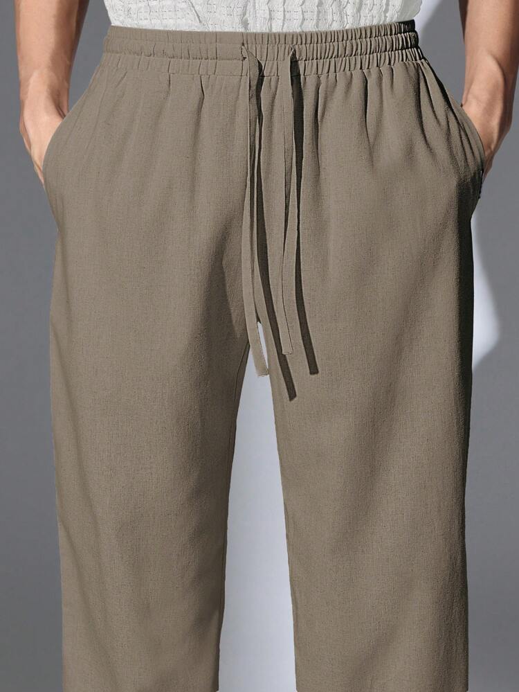 Męskie spodnie casualowe typu skater fit z lnianym wyglądem i ściągaczem w pasie