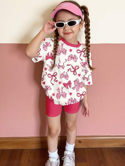 SHEIN Happikins 2pcs Young Girls Casual Cute Pink Leopard Print, Bow Heart Graphic Short Sleeve Top And Shorts Set, Suitable For Summer