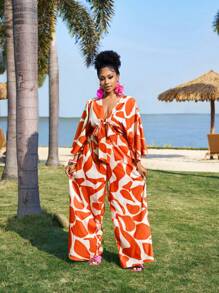 Slaydiva Elegantes romantisches Jumpsuit mit Blumenmuster und Bindedetail in Große Größen, Frühlings- und Sommerbekleidung für Frauen, formelle orangefarbene Hosen für Urlaubsoutfits von Frauen, Resort-Bekleidung