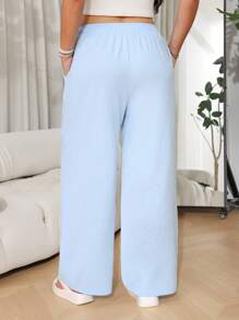 SHEIN EZwear Pantalones casuales sueltos de pernera ancha con cinturón en color liso para mujer de talla grande