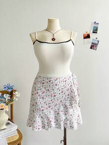 Soleia Jupe mini plissée décontractée pour les vacances, aux couleurs florales mélangées avec un ourlet à volants enroulé, pour les formes généreuses