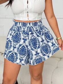 Flirla بناطيل قصيرة كاجوال من فئة البلس سايز للنساء ذات خصر مرتفع و نمط طباعة أزهار مرن، طراز للرحلات والعطلات - الأزرق - مشاهدة 4