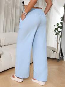 SHEIN EZwear Pantalones casuales sueltos de pernera ancha con cinturón en color liso para mujer de talla grande