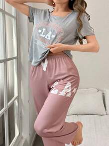SHEIN Set de 2 piezas de pijama de mujer con top de cuello redondo de manga corta con estampado de letras y pantalón largo, de estilo casual