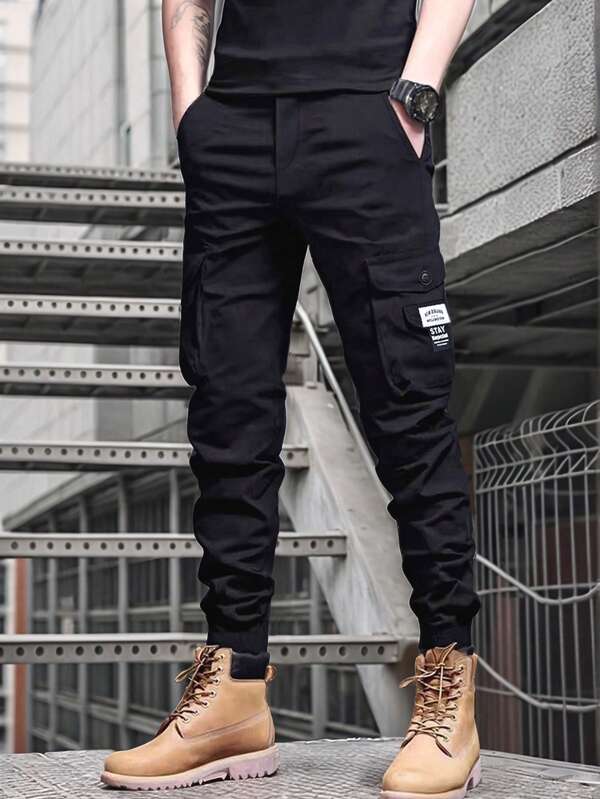 Manfinity Homme Men's Casual Drawstring Waist Elastic Waistband Cargo Pants Black Cargo Pants Men Cargo Pants Men Joggers Streetwear Men Pants,, Cargo Pants For Men,Mature Casual Trousers For Men. This Trousers Are In A Black Color And Are Versatile And Practical, Making It Easy To Meet The Wearing Needs Of Different Occasions. The Foot End Is Designed With A Rubber Band, Which Both Enhances The Leg Shape And Adds A Sense Of Sports And Leisure, And Is Suitable For A Variety Of Wear Styles. It's A Versatile Product In A Men's Wardrobe. It Is Suitable For Daily Leisure, Weekend Trips, Outdoor Activities, Travel Expeditions, Relaxed Work Environments Or Semi-Formal Occasions.