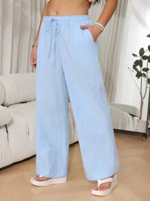 SHEIN EZwear Pantalones casuales sueltos de pernera ancha con cinturón en color liso para mujer de talla grande