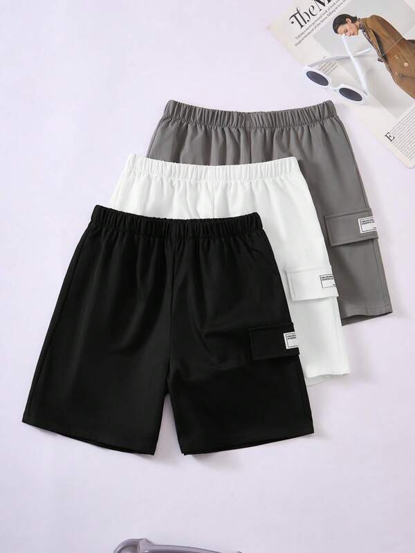 Set de 3 piezas de pantalones cortos informales y sueltos de color liso y versátiles para adolescentes varones, apropiados para primavera y verano. Compra 1 y llévate 2 gratis, consigue 3 piezas aptas para las temporadas de primavera y verano