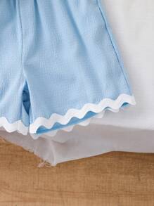 Conjunto de 2 piezas de niña (talla pequeña) con top sin mangas con textura y ribete contrastante, y pantalones cortos informales