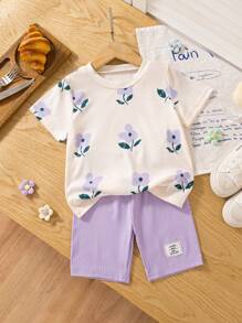 SHEIN Conjunto de Ramadán de 2 piezas para niñas con camiseta de manga corta de cuello redondo con estampado floral y pantalones ajustados a rayas, atuendo casual y dulce de verano