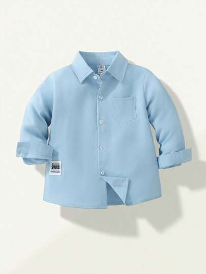 SHEIN Explorewe Young Boy Casual Solid Color Long Sleeve Shirt With Decorative Small Badge, Versatile For Daily Casual Wear, Travel, Gatherings, And School, Suitable For Spring And Autumn,Holiday,Summer,Travel