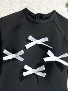 Tween Mädchen Badeanzug für die Übergangsphase, schwarze einfarbige bedruckte Langarm-Ausführung