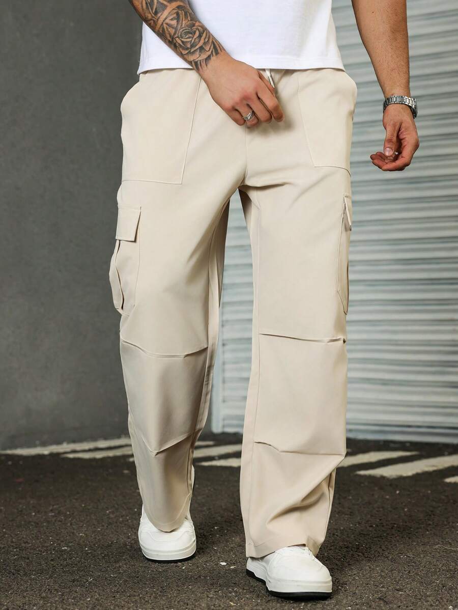 Manfinity Homme Pantalones casuales de unicolor con bolsillos cargo para hombres de talla grande, otoño - Albaricoque - Ver 1