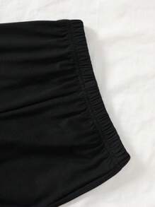 Set de 2 piezas de moda elegante y dulce para niñas de 4 a 7 años, que incluye 1 pieza de blusa sin mangas con panel de punto negro, volantes de organza brillante color albaricoque y detalles florales, y 1 pieza de pantalón negro con cintura elástica y volantes, adecuado para primavera/verano, diario, exterior, viaje, eventos nocturnos, ceremonia y aniversario de cumpleaños