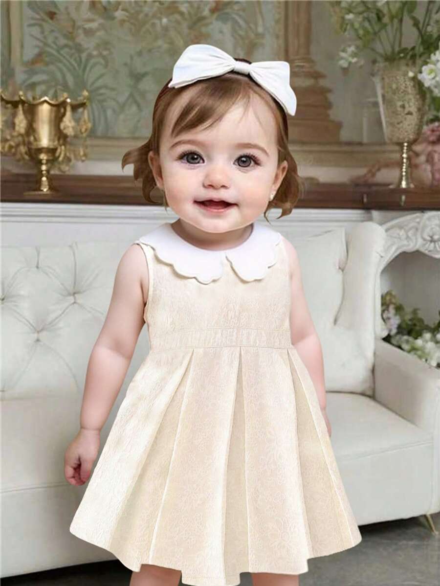 Babygirl's Summer Blue Woven Jacquard Fabric Sleeveless Elegant And Lightweight Dress, With A Comfortable Silhouette, Is Ideal For The Warm Season. In Its Design, It Is Complemented By A Unique White Wavy Embroidered Collar, Adding A Refined And Elegant Touch. Whether For Outings, Shopping, Or Attending Parties, It Ensures The Child Will Be More Noticeable In A Crowd.