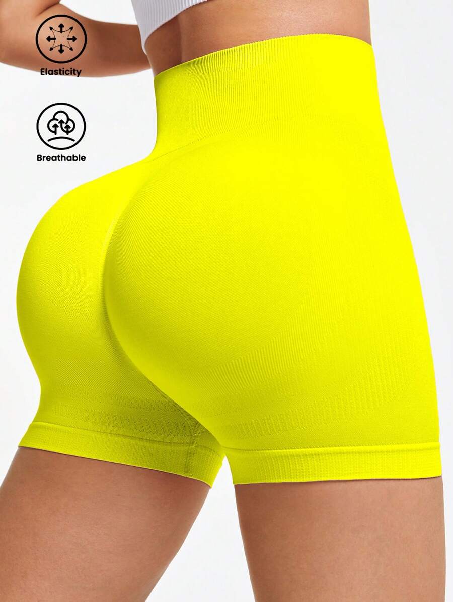 SHEIN Sports Pantalones cortos sin costuras para mujer de cintura alta de unicolor para hacer ejercicio - Amarillo - Ver 1