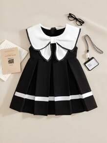 Souflis Souflis 女宝宝3D蝴蝶结水手领A字连衣裙。饰有3D蝴蝶结水手领，增添一丝可爱。A字廓形，优雅大方，适合各种场合，无论是散步、居家休闲，还是参加校园活动、派对聚会，都能展现宝宝的独特魅力。 - 黑與白 - 查看 1