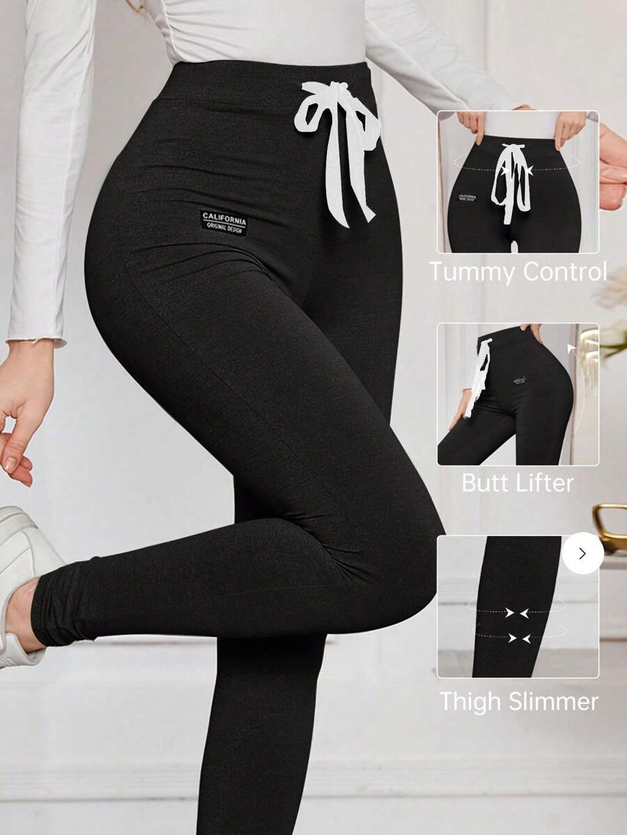 Modelyn 女式字母印花抽绳腰紧身休闲裤