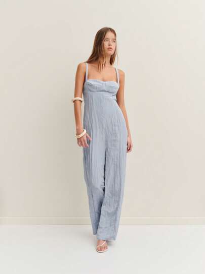 Nöista Strap Jumpsuit With A Fitted Bodice And Flowing Wide Legs, Perfect For An Effortless Yet Elegant Summer Look, Ideal For Daytime Events Or Relaxed Evenings.