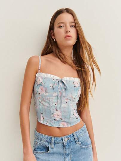 Nöista 带有褶边细节和蝴蝶结的花卉紧身胸衣式上衣 - 让您尽享清新、阳光的春夏氛围。