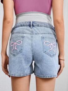 SHEIN Shorts vaqueros casuales para maternidad con cintura ajustable, bordado de lazo