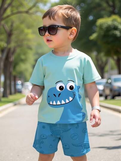 SHEIN Playful Pals 1 套幼儿男孩可爱卡通恐龙头和恐龙骨架印花短袖 T 恤和短裤套装，轻便休闲，适合春夏季穿着