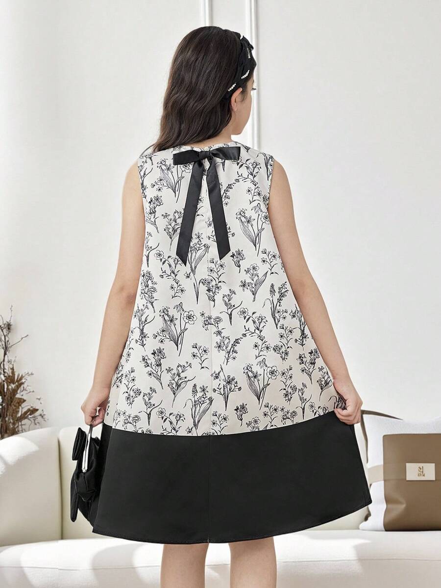 فستان من البناتالصغيرات مطبوع بالأزهار مخصر بشكل جيب مع فيونكة خلفية، سيلويت مرتفع وأنيق