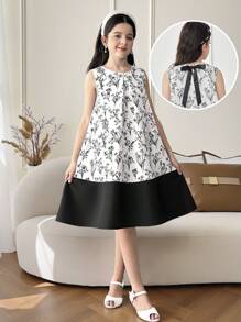 فستان من البناتالصغيرات مطبوع بالأزهار مخصر بشكل جيب مع فيونكة خلفية، سيلويت مرتفع وأنيق