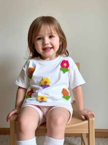 SHEIN Camiseta de punto de manga corta casual con estampado floral lindo para bebé niña, versátil para el verano - Blanco - Ver 1