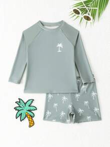 SHEIN Conjunto de traje de baño de niño pequeño estampado con palmeras, elegante y adorable. Conjunto de 2 piezas para niños pequeños. Ropa de playa para niños de 3 a 7 años