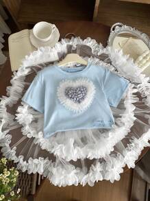 SHEIN 2 pezzi Set bambina - maglietta a maniche corte con scollo tondo e cuore 3D + gonna a ruota stile torta. Design elegante a cuore 3D, gonna a ruota stile torta, adatta per gioco all'aperto, casual a casa, attività scolastiche, feste di compleanno e altre occasioni, permettendo alla tua piccola principessa di godersi l'estate gioiosa! - Multicolore - Visualizzare 14