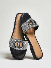 SHUZIA Sandalias deslizables de mujer Luxe Glow negras con detalles con cristales y logotipo dorado | Comodidad y lujo para el estilo de verano de resort a cafetería - Negro - Ver 2