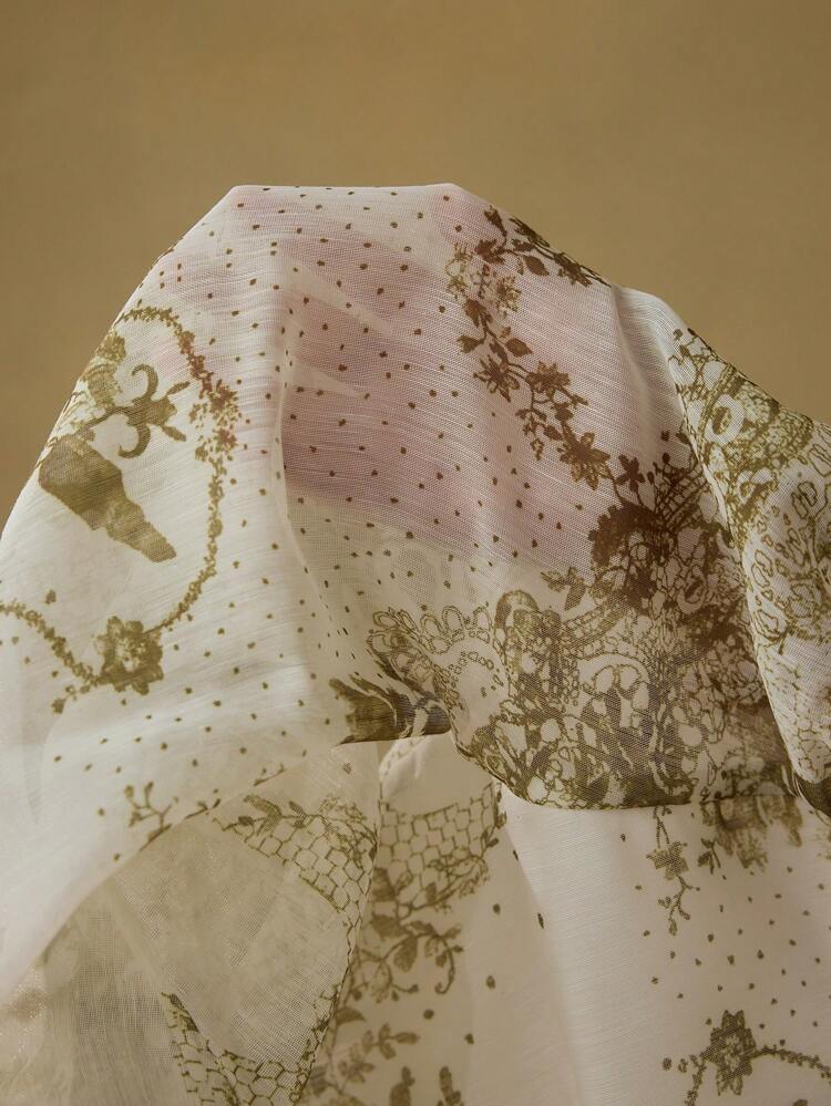 Blusa con stampa all-over e un solo bottone