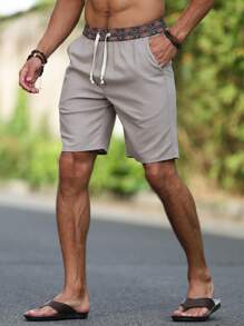 Manfinity Nomadique Pantalones cortos de pierna recta de tela de lino holgados para hombres, con estampado floral en la cintura, estilo nepalí, adecuados para vacaciones y atuendos de viaje