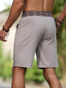 Manfinity Nomadique Pantalones cortos de pierna recta de tela de lino holgados para hombres, con estampado floral en la cintura, estilo nepalí, adecuados para vacaciones y atuendos de viaje