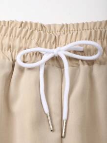 Manfinity KASUA Conjunto de camiseta de manga corta con botones y estampado de palmeras + pantalones cortos con cordón - Traje de baño, verano, hawaiano para hombres