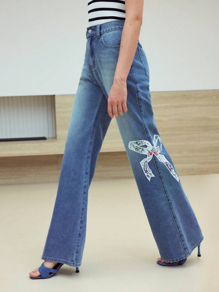 MOTF STUDIO BOW EMBROIDERY WASHED FLARE LEG JEANS