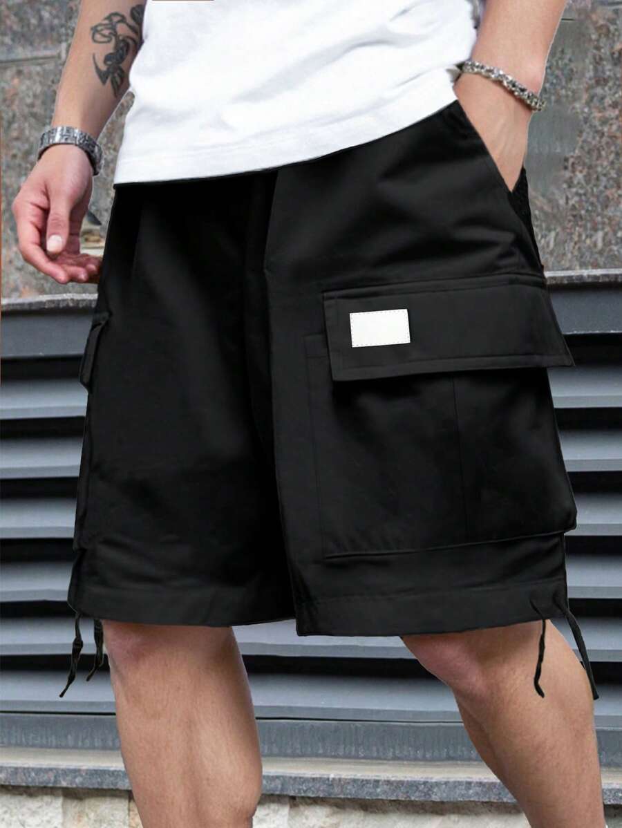 Manfinity LEGND Men's Mature Streetwear Drawstring Waist Cargo Shorts,Mature Men's Street Shorts. These Men's Shorts Choose A Classic Black Tone To Be Low-Key And Versatile. Custom Black Leather Labeling Is Adorned On The Packing Pockets, Adding Recognition To The Overall Design, And A Low-Key Attitude Is Displayed In The Details. It Is Suitable For Easy Social Activities Such As Daily Leisure, Weekend Trips, Friends' Gatherings, Travel And So On. These Trousers Are An Indispensable Item In A Man's Wardrobe And A Great Gift For A Boyfriend Or Husband. - Black - View 1