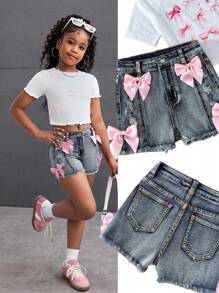 SHEIN Quần short denim co giãn màu xanh dương ôm sát, chất liệu mềm mại, thích hợp mặc hàng ngày, mùa hè, mùa xuân, đi lễ hội và đi biển, phù hợp cho bé gái tuổi teen, phong cách thường ngày Y2K, rách rưới, tua rua và nơ lớn màu hồng. - Màu xanh lam - Xem 2