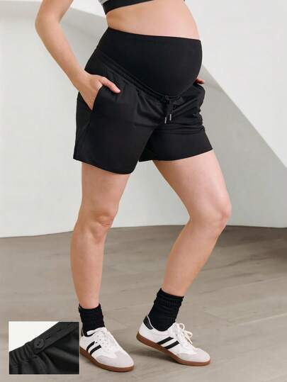 GLOWMODE Short de maternité FeatherFit™ de 5 pouces, forme trapèze, taille ajustable à cordon, poches sur les côtés, coupe près du corps extensible, idéal pour le yoga à faible impact, le pilates, et le port quotidien décontracté pendant la grossesse