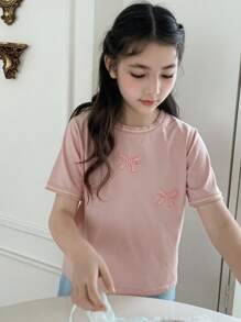 Hapijoa Camiseta casual de manga corta con cuello redondo y decoración de lazo para niña preadolescente, ideal para el verano y el regreso a clases - Rosa - Ver 3