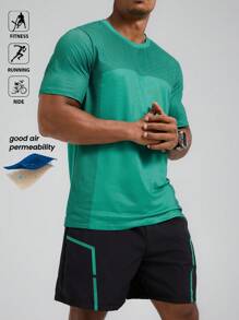 Manfinity Sport Polished Conjunto de ropa deportiva de 2 piezas para hombre con Top de cuello redondo de manga corta en verde y pantalones cortos negros - Conjunto de ropa para entrenamiento, correr