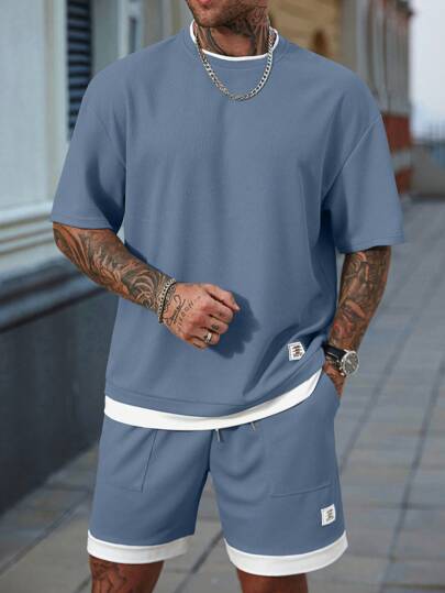 Manfinity CasualCool 2 piezas Conjunto de camiseta de manga corta con parches de color contrastante y pantalones cortos con bolsillo para hombres, Conjunto de verano holgado de 2 piezas para hombres, Conjunto de 2 piezas cómodo