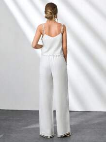 CLARA VERO Conjunto de 2 piezas de mujer con Top sin mangas de tela de bambú tejida de unicolor con detalles de pompones y pantalones rectos de pierna ancha con bolsillos laterales y pliegues delanteros. Outfit de primavera y verano para vacaciones y salidas