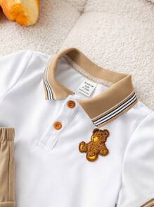 SHEIN Conjunto de 2 peças para bebê menino, fofo e casual, com estampa de urso em blocos de cores, composto por camisa polo de manga curta e shorts com elástico na cintura. Ideal para festas de aniversário, eventos noturnos, apresentações, casamentos, comemorações de 1 mês, batizados e chás de bebê. Roupa de verão para bebê menino. Conjunto de shorts para bebê menino. Camisa polo e shorts para bebê menino. Conjunto de verão para bebê menino. Conjunto de roupas para bebê menino. Shorts cáqui para bebê menino. - Multicolorido - Ver 9