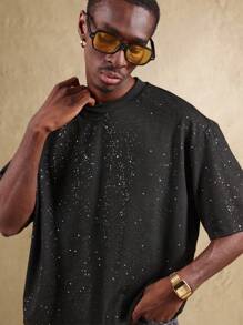 SUMWON Camiseta oversize con estampado de galaxia, diseño cósmico con chispas, apta para usarse en festivales, conciertos y eventos, con patrón celestial, uso unisex - Negro - Ver 1