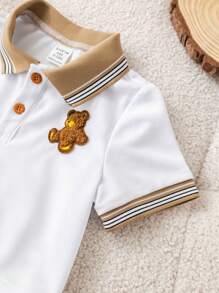 SHEIN Conjunto de 2 peças para bebê menino, fofo e casual, com estampa de urso em blocos de cores, composto por camisa polo de manga curta e shorts com elástico na cintura. Ideal para festas de aniversário, eventos noturnos, apresentações, casamentos, comemorações de 1 mês, batizados e chás de bebê. Roupa de verão para bebê menino. Conjunto de shorts para bebê menino. Camisa polo e shorts para bebê menino. Conjunto de verão para bebê menino. Conjunto de roupas para bebê menino. Shorts cáqui para bebê menino. - Multicolorido - Ver 8